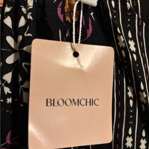 BloomChic Black Dress with Orange and White Floral Design